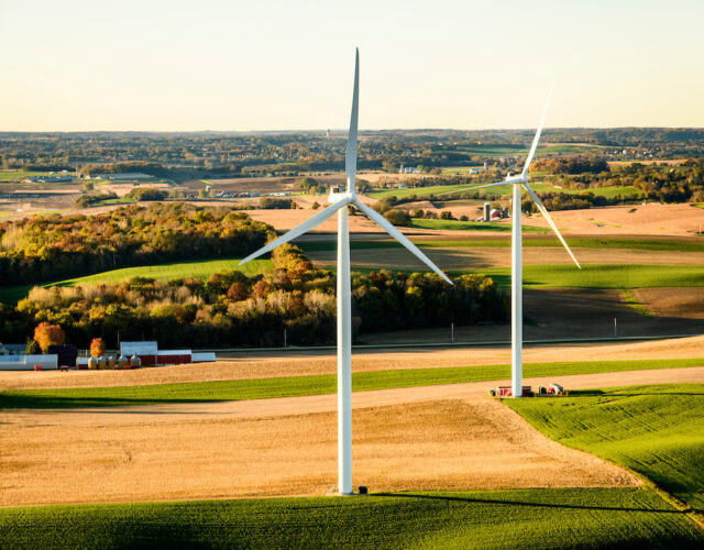 Windmill turbines in rural Wisconsin farm.
