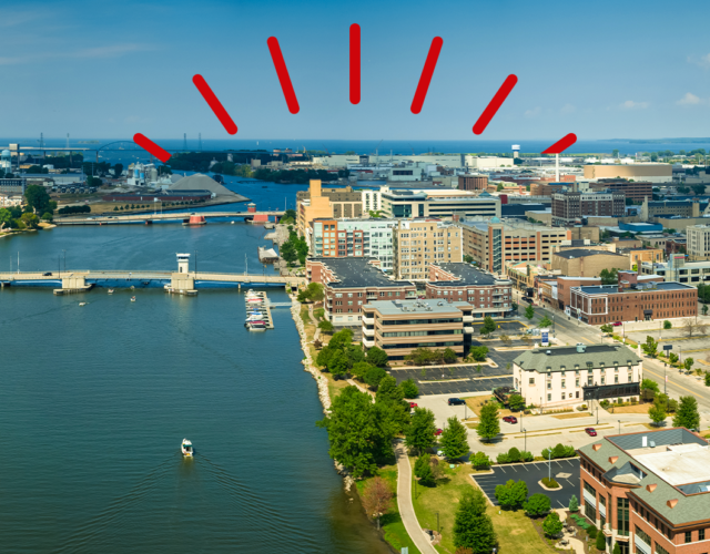 Aerial photo of Green Bay waterfront area on sunny day.