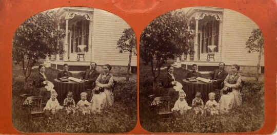 Two identical side by side sepia-toned photos of Professor Rasmus Anderson, his family and visitors sitting outdoors near a home.