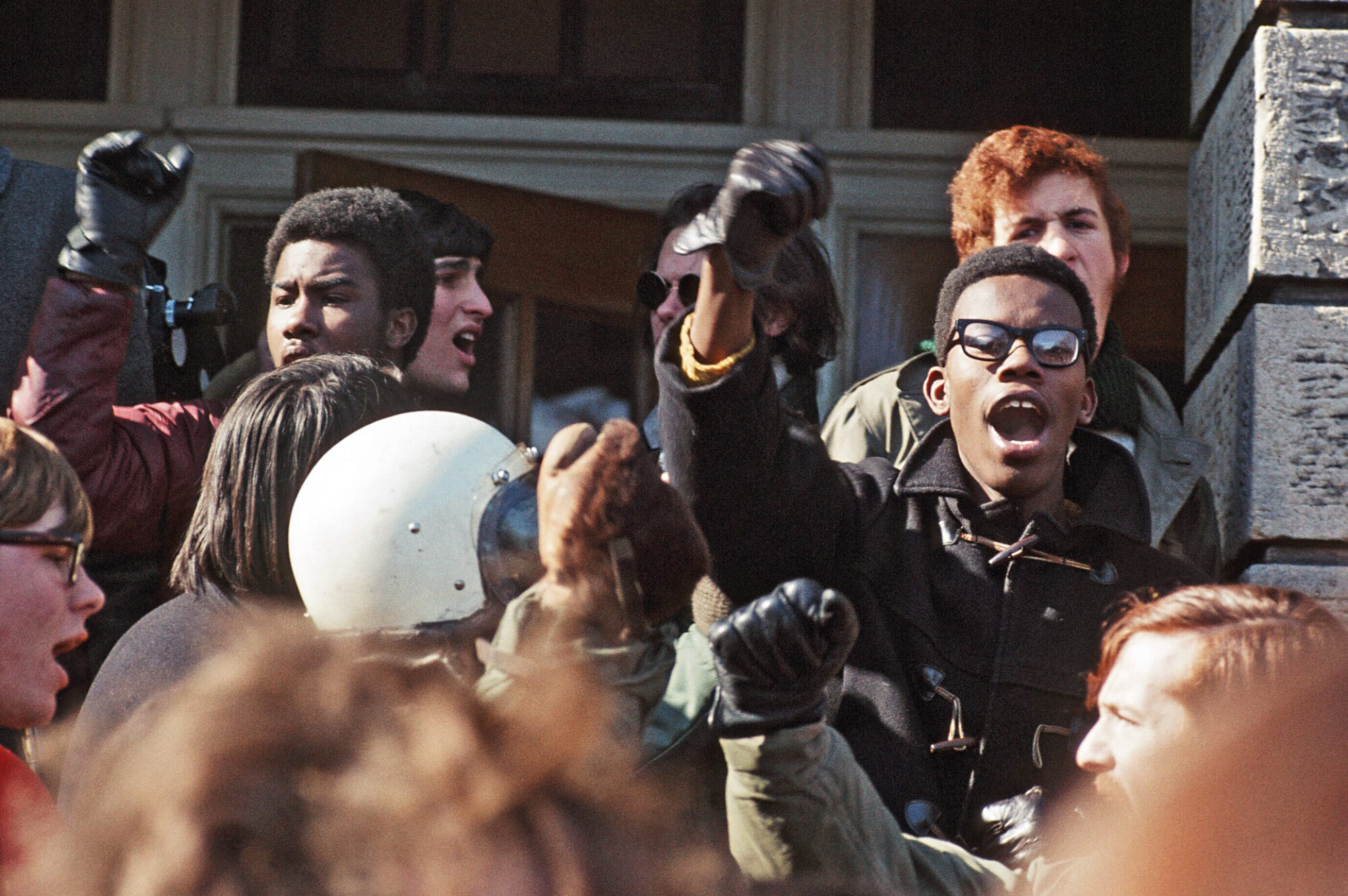 Students leading chant at rally outside of Bascom Hall during 1969 Black Student Strike.