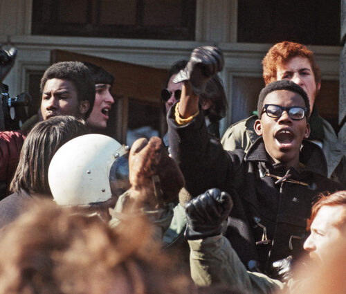 Students leading chant at rally outside of Bascom Hall during 1969 Black Student Strike.