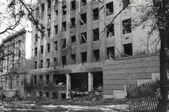 Extensive damage to Sterling Hall, including windows blown out and scattered debris in aftermath of bombing.