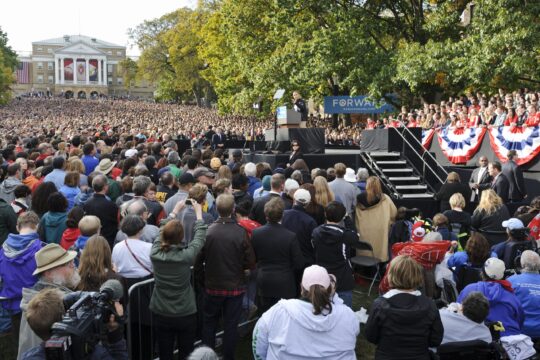 Tens of thousands of spectators fill Bascom Hill while President Barack Obama speaking on stage.