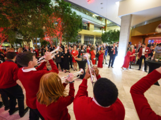 175 Gala - UW Marching Band Several trumpet players performing to group of onlookers.