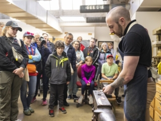 175 Open House - Metalsmithing Demo Group of spectators watching metalsmithing demonstration.